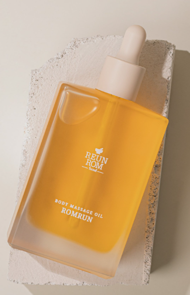 Romrun Body Massage Oil bottle with citrusy and herbal scents, free from irritating substances.